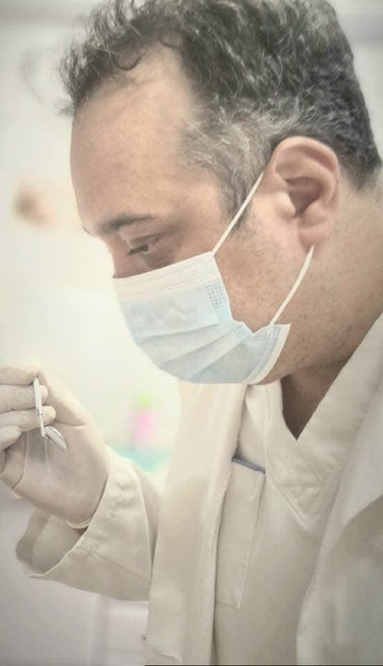 Professional dentist in modern clinic